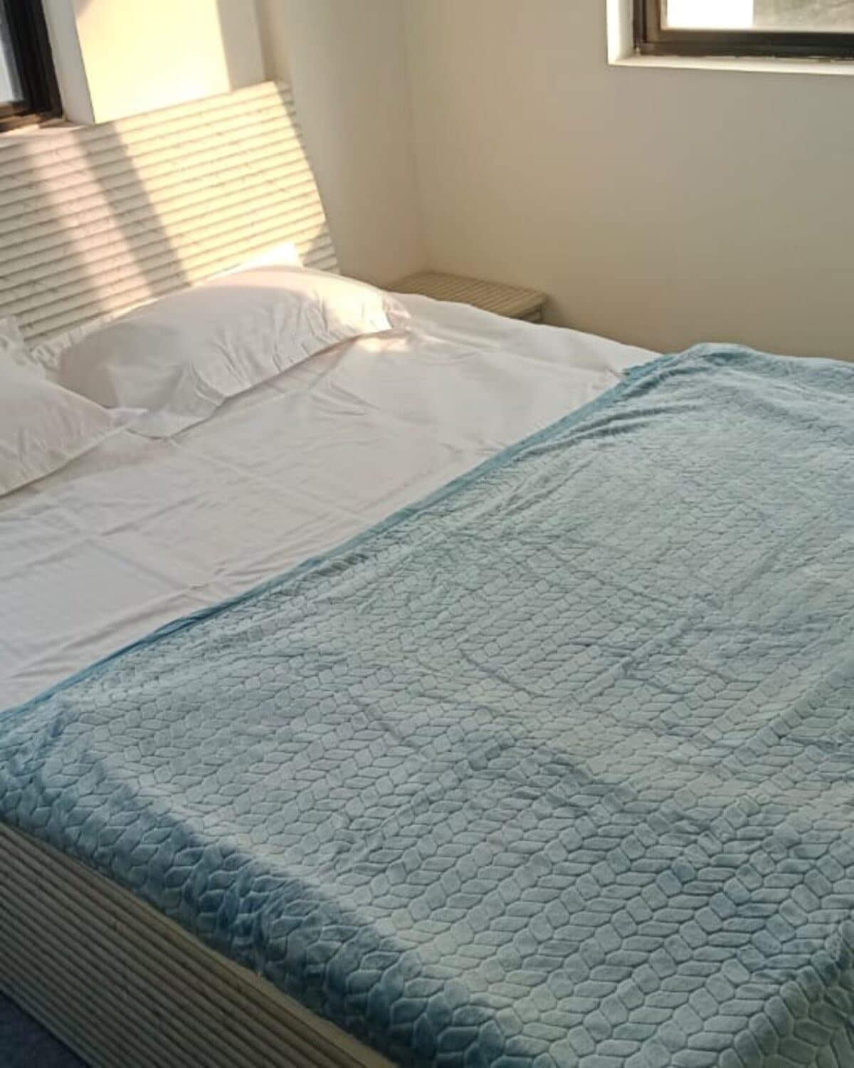 A bedroom at Habitat, Undri — bright window, fresh finish